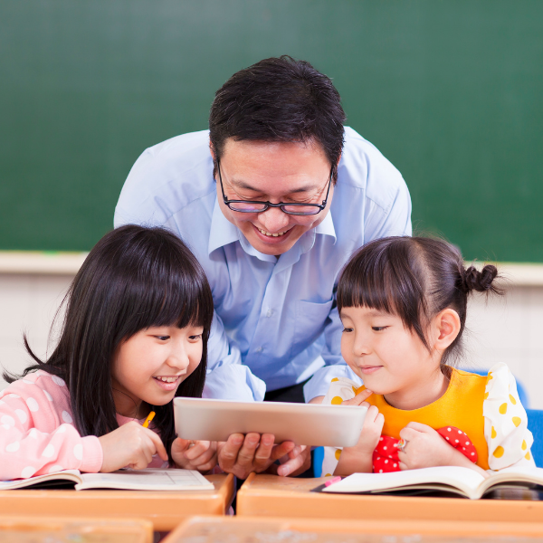 teacher with children and tablet